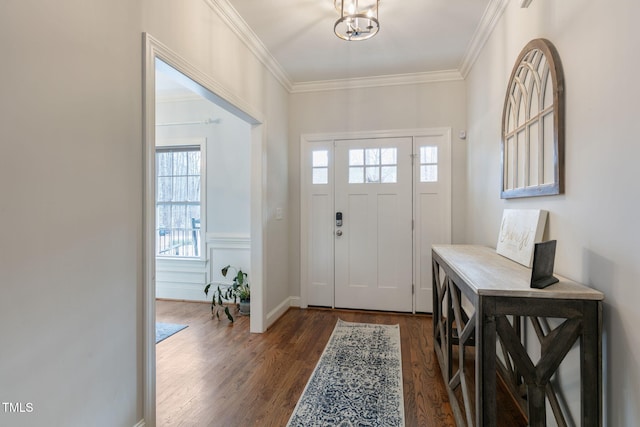 foyer featuring ornamental molding and dark wood-style flooring