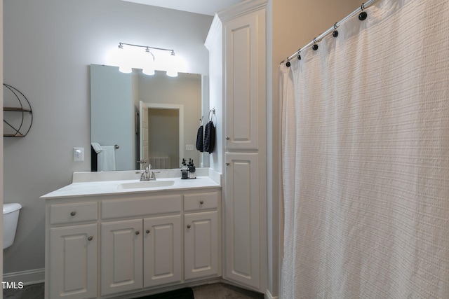 full bath featuring toilet and vanity