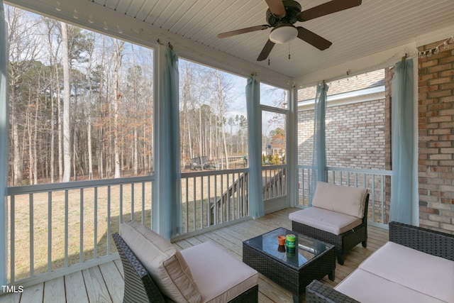 sunroom / solarium with ceiling fan