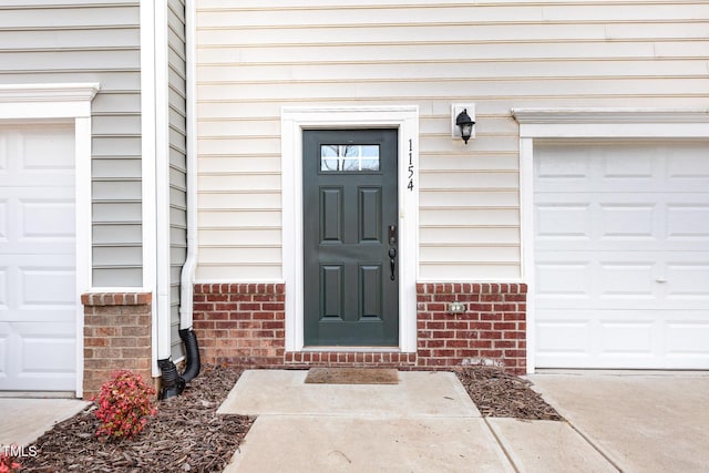 property entrance with brick siding