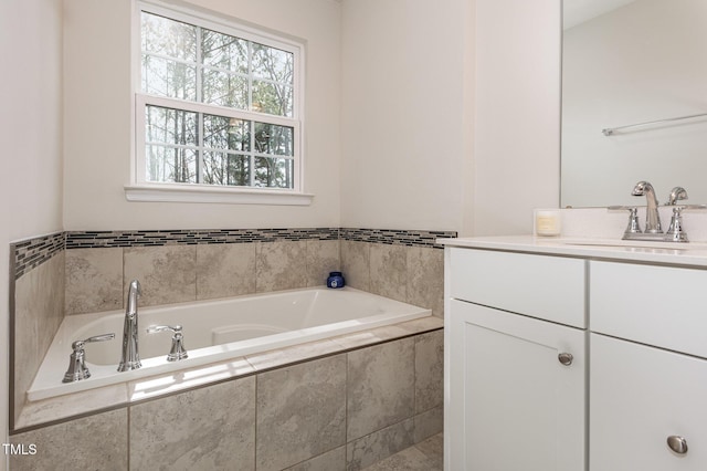 full bath featuring a bath and vanity