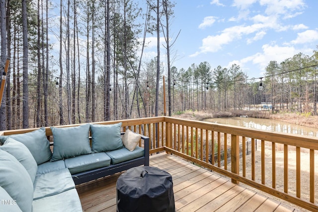 wooden deck with an outdoor living space