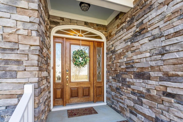 entrance to property featuring stone siding