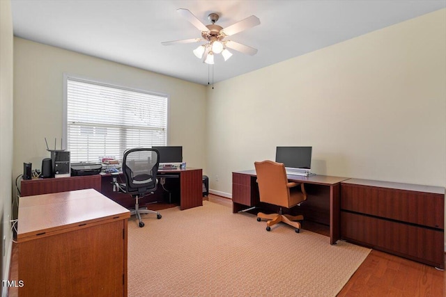 office space featuring a ceiling fan