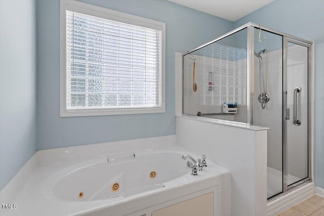 full bath featuring a whirlpool tub and a shower stall