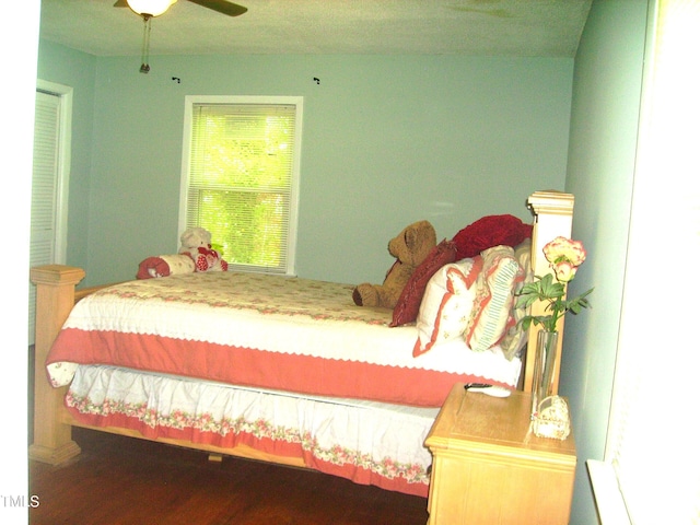 bedroom with ceiling fan and wood finished floors