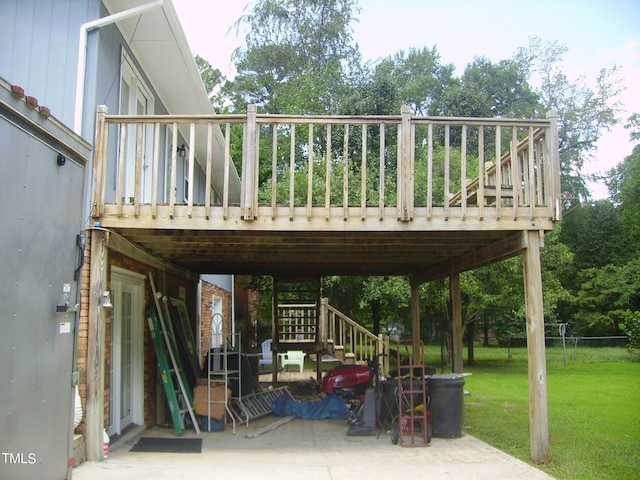 view of property's community with stairs, a yard, a carport, and a deck