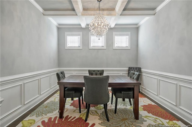 dining room with a chandelier, a healthy amount of sunlight, beamed ceiling, and coffered ceiling