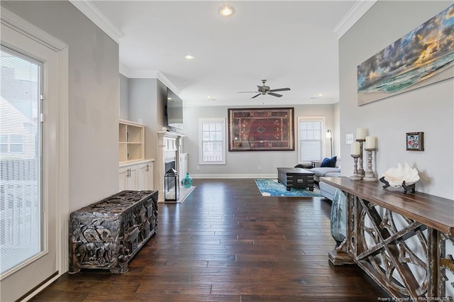 interior space with baseboards, dark wood-style flooring, recessed lighting, and crown molding