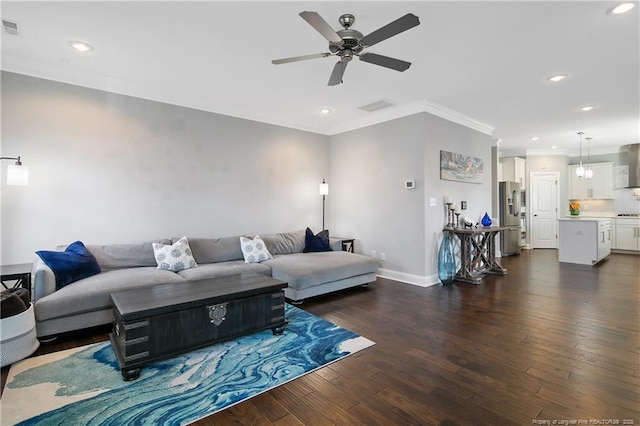 living room with dark wood-type flooring, recessed lighting, visible vents, and crown molding