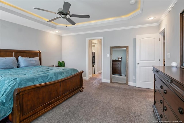 carpeted bedroom featuring crown molding, ceiling fan, a raised ceiling, and baseboards