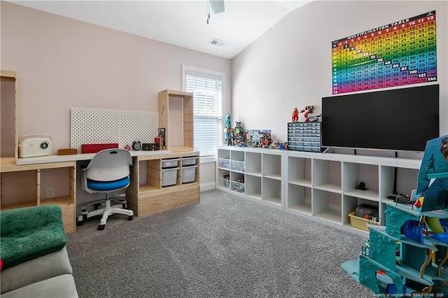 carpeted office with lofted ceiling and visible vents