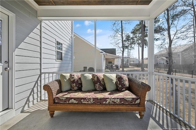 sunroom with a residential view