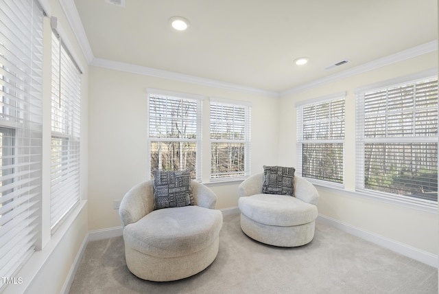 sitting room featuring visible vents, ornamental molding, recessed lighting, carpet, and baseboards