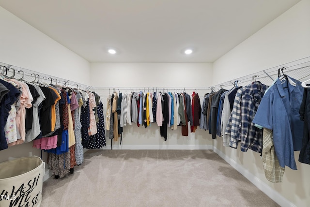 spacious closet with carpet flooring