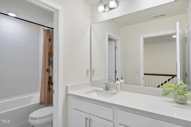 full bathroom with visible vents, toilet, shower / tub combo with curtain, and vanity