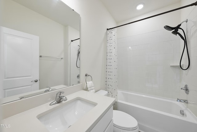 bathroom with toilet, vanity, and shower / bath combo