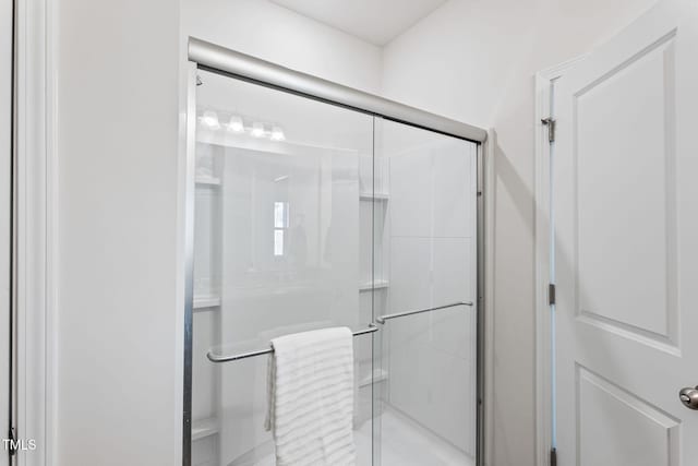 full bathroom featuring a stall shower