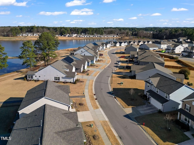 bird's eye view featuring a residential view and a water view