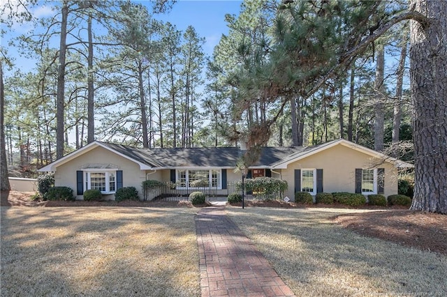 ranch-style house with stucco siding