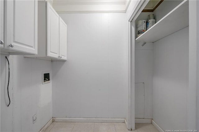 laundry room with washer hookup and cabinet space