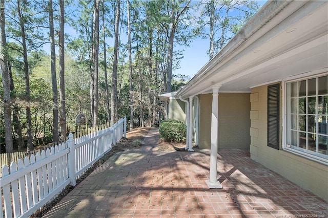 view of patio / terrace featuring fence