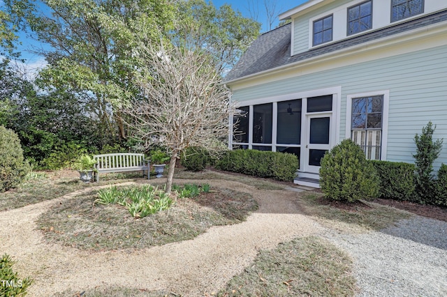 view of yard featuring a sunroom