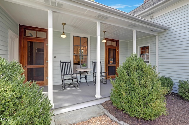 entrance to property featuring covered porch