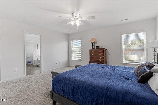 carpeted bedroom featuring visible vents, ceiling fan, and baseboards