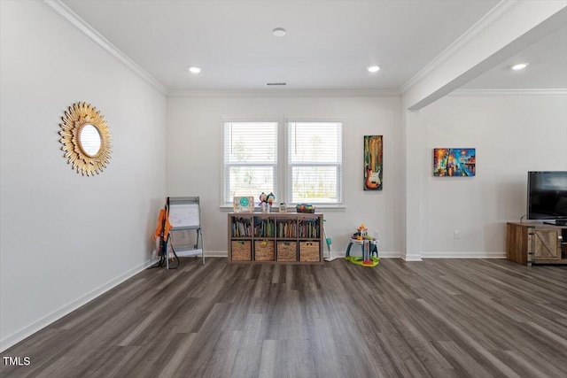 interior space featuring crown molding, baseboards, and wood finished floors