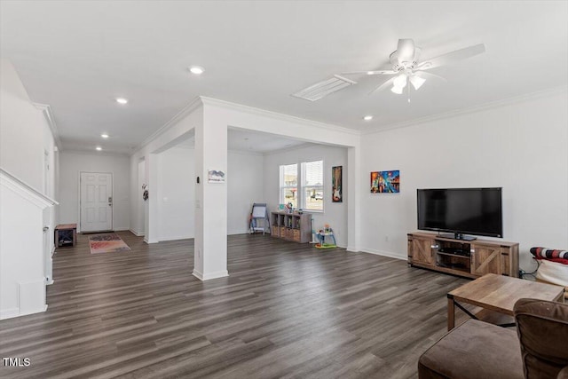 living area featuring dark wood-style floors, baseboards, ornamental molding, and recessed lighting