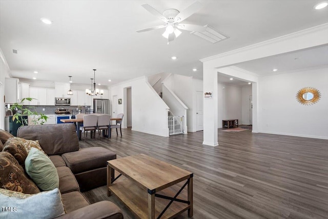 living area featuring baseboards, stairway, dark wood-style flooring, crown molding, and recessed lighting