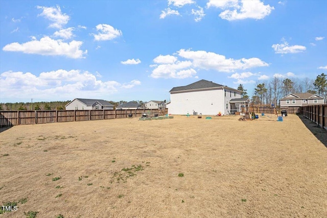 view of yard with a fenced backyard