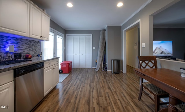 kitchen featuring dark wood-style floors, white cabinets, crown molding, and stainless steel dishwasher