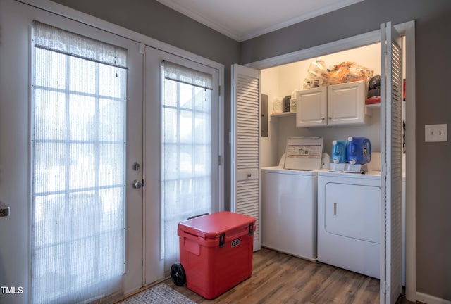 washroom with cabinet space, ornamental molding, wood finished floors, independent washer and dryer, and french doors