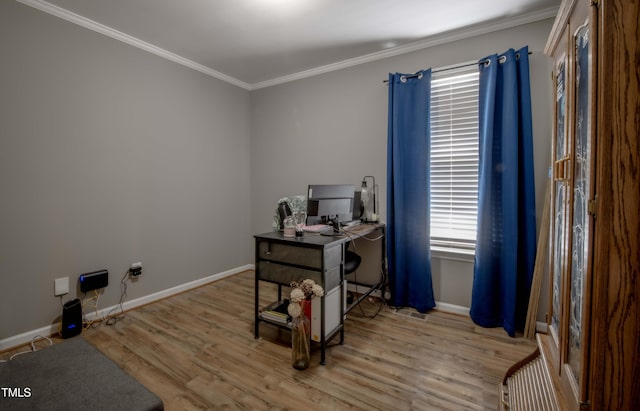 office space with ornamental molding, baseboards, and wood finished floors