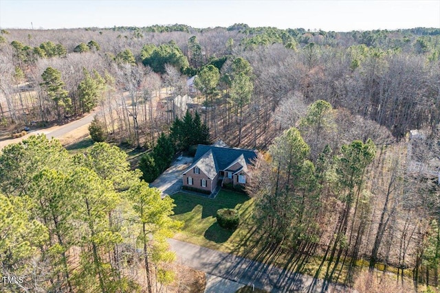 aerial view featuring a wooded view