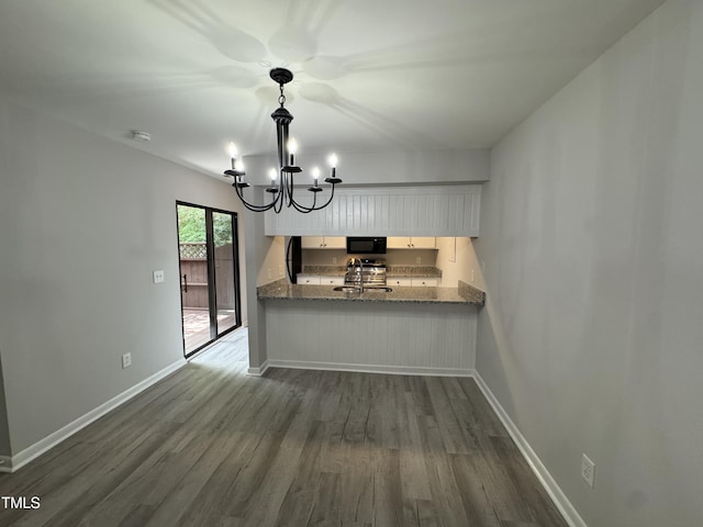 159 Finley Forest Dr, Chapel Hill, NC 27517 - kitchen with black microwave, a sink, dark wood-style floors, and a chandelier