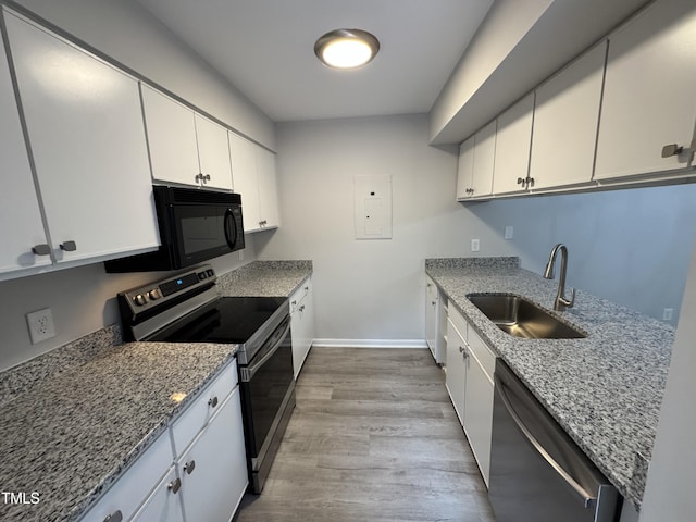 159 Finley Forest Dr, Chapel Hill, NC 27517 - kitchen featuring stainless steel electric stove, a sink, dishwashing machine, black microwave, and wood finished floors