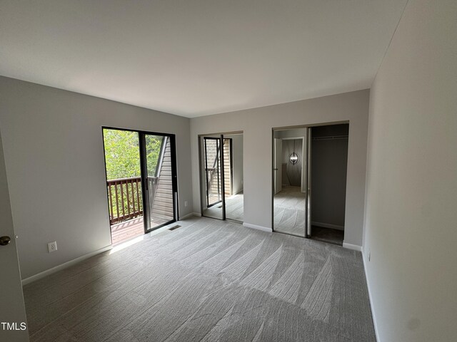 159 Finley Forest Dr, Chapel Hill, NC 27517 - unfurnished bedroom featuring access to outside, carpet flooring, and baseboards