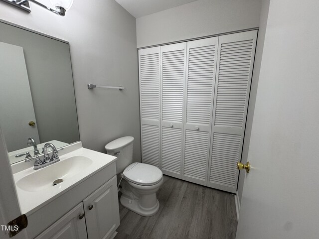 159 Finley Forest Dr, Chapel Hill, NC 27517 - bathroom featuring a closet, wood finished floors, toilet, and vanity