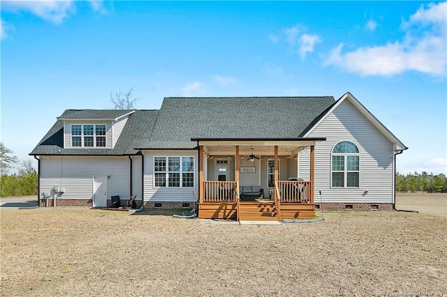 view of front facade featuring crawl space, covered porch, a ceiling fan, and roof with shingles