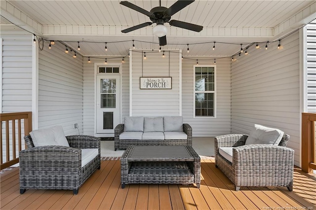 wooden terrace with ceiling fan and an outdoor hangout area