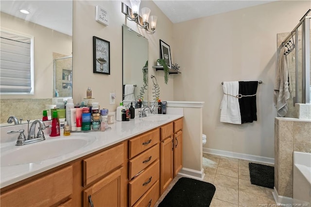 bathroom with tile patterned flooring, a sink, and a tile shower