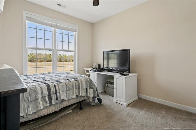 bedroom featuring a ceiling fan, carpet, visible vents, and baseboards