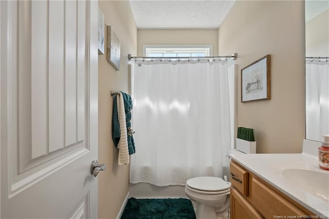 full bathroom featuring toilet, shower / bath combo, a textured ceiling, and vanity