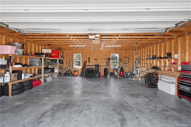 garage featuring a workshop area and a garage door opener