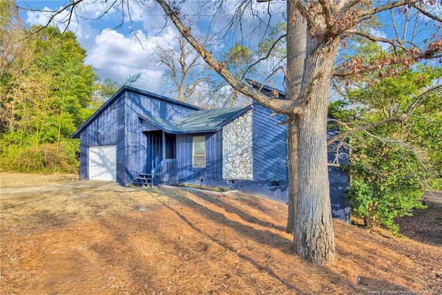 view of front of property with a garage and crawl space