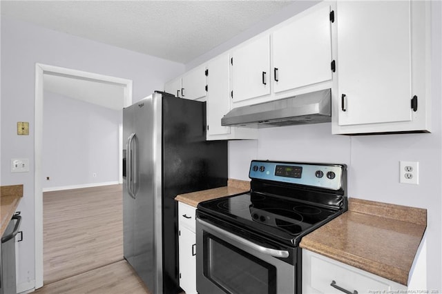 kitchen with white cabinets, light wood-style floors, appliances with stainless steel finishes, a textured ceiling, and under cabinet range hood