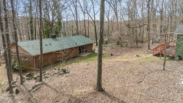 view of yard featuring a view of trees